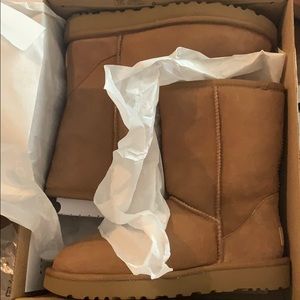 Ugg boots dark tan, new with tags never been worn.